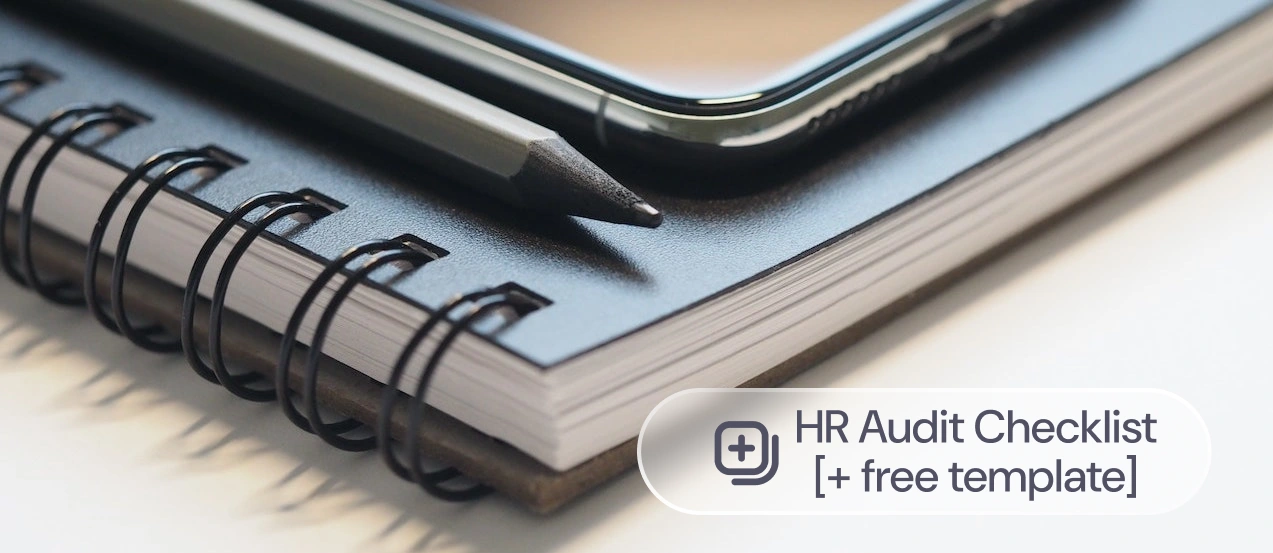 A notebook and pen on a desk, with the label: HR Audit Checklist
