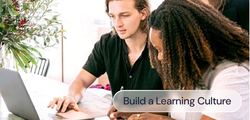 Two people learning together at a computer
