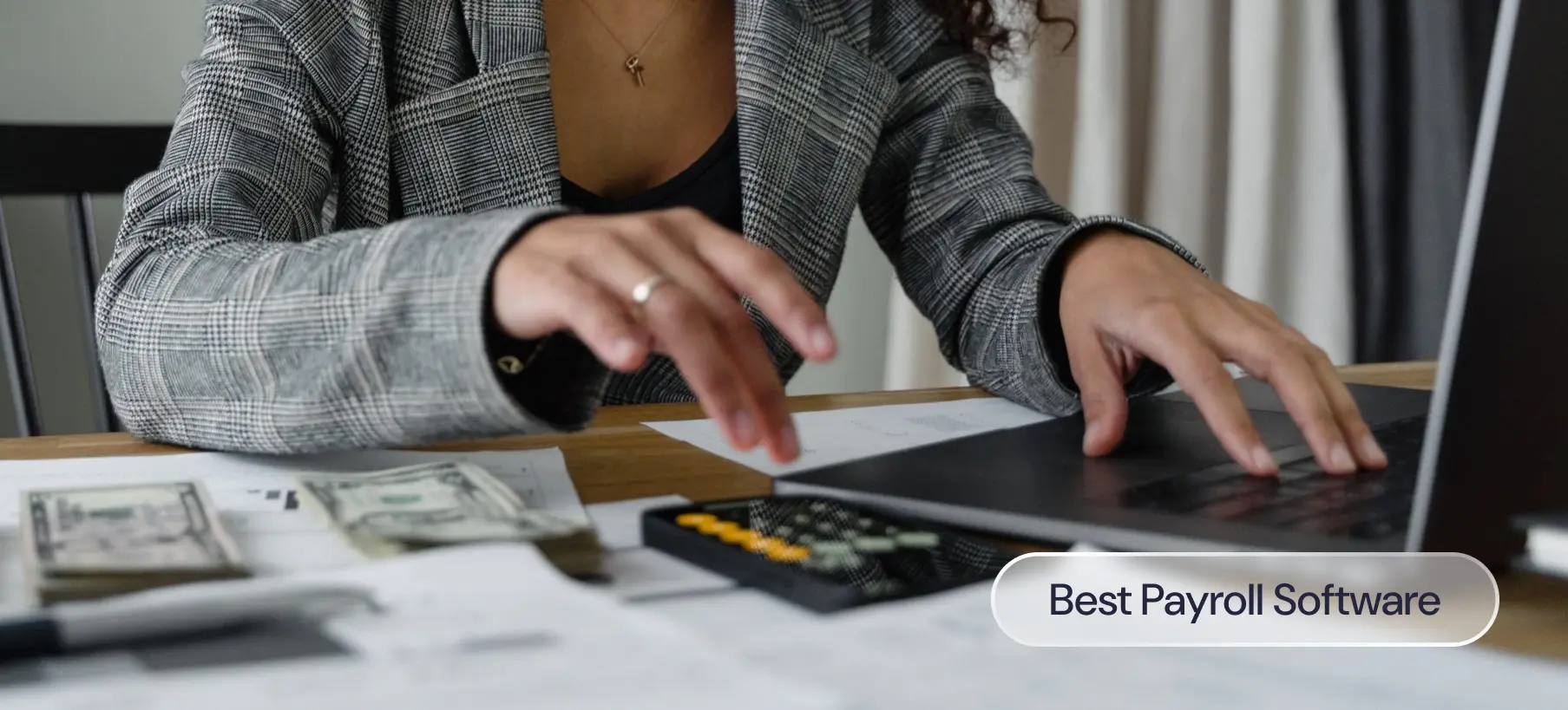 A woman at her desk working on a laptop and calculator, with a label that reads: Best payroll software