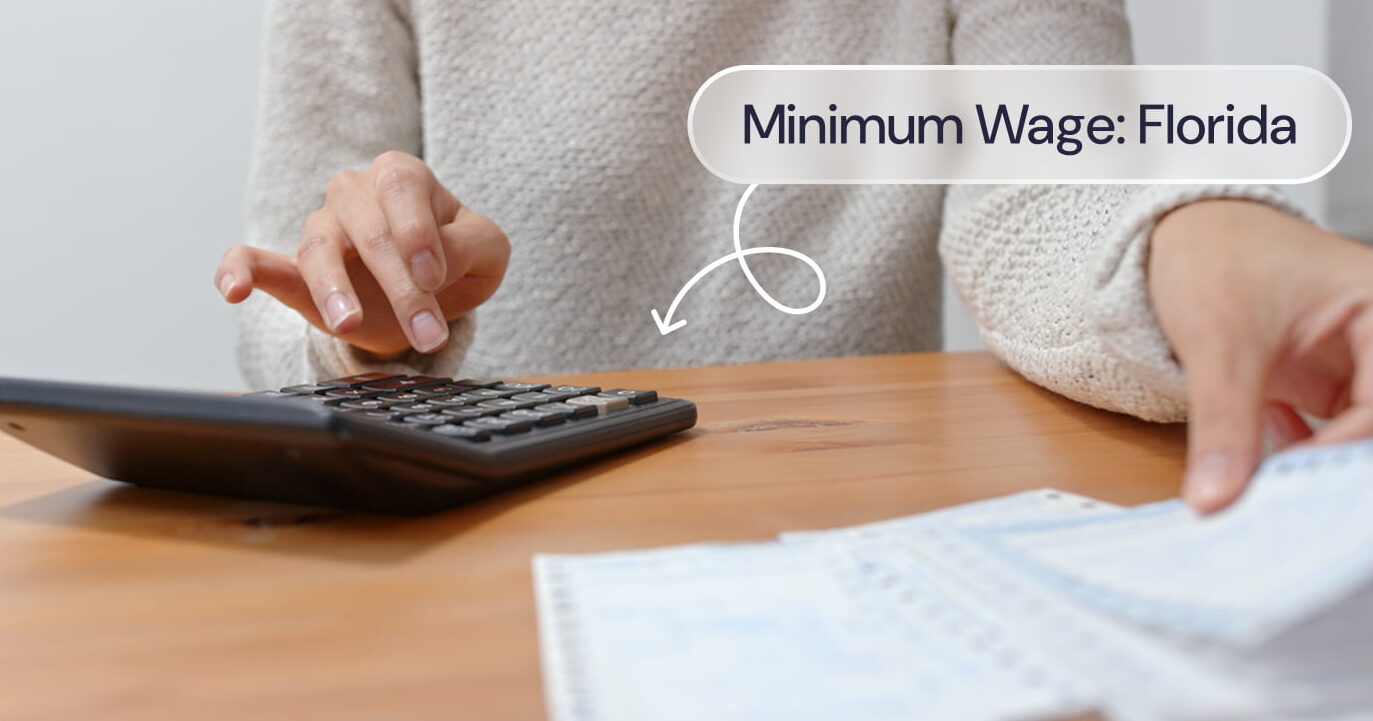 A woman using a calculator with the words 